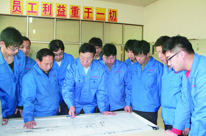 Worker testing steel wire rope sample