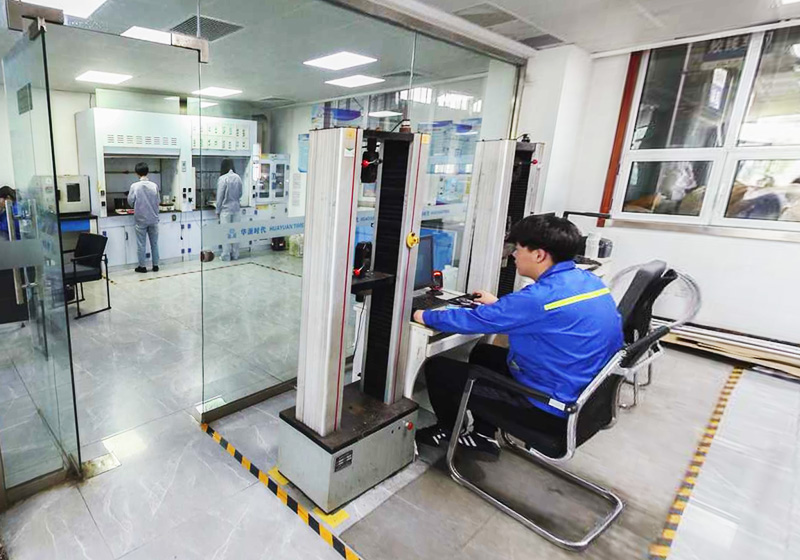 Worker inspecting galvanized steel wire